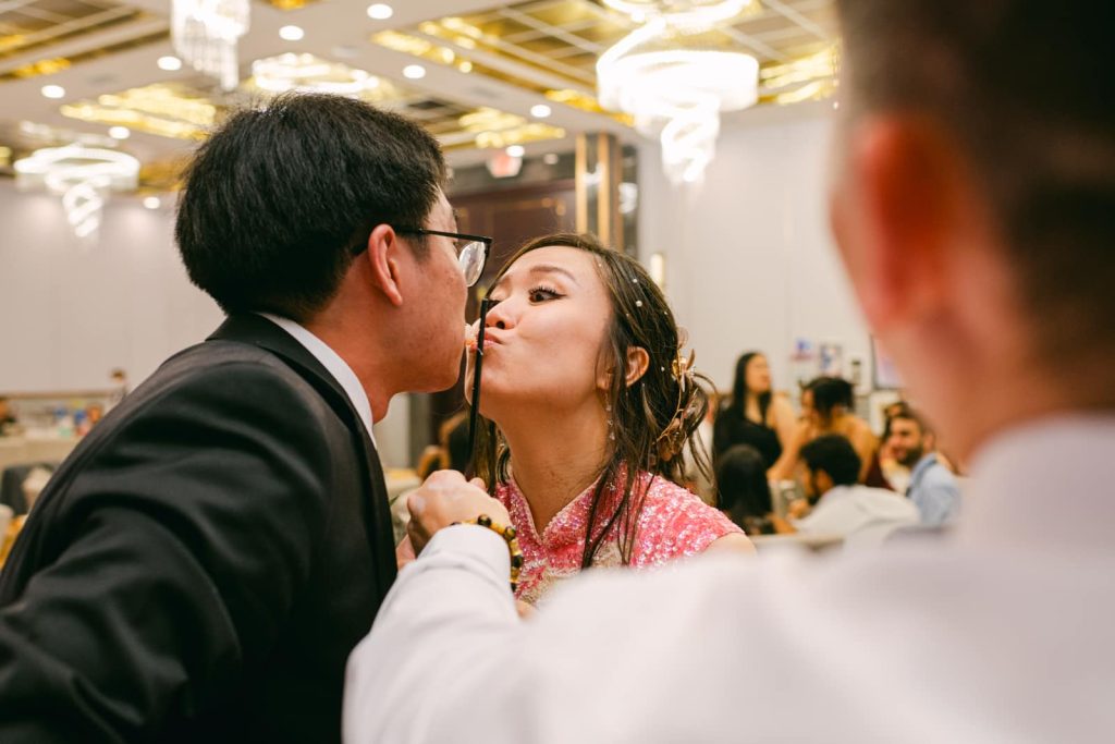 newlyweds kiss in front of guests at Canton House