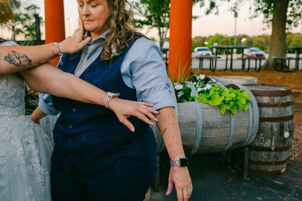 bride covered in colorful powder at wedding reception photographed by atlanta wedding photographer